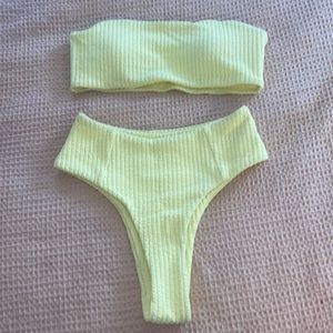 brand new , never worn, pastel yellow strapless swimsuit.